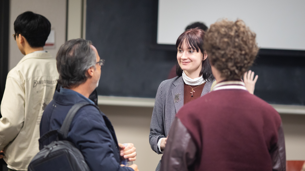 A student speaks with Jason Rothenburg